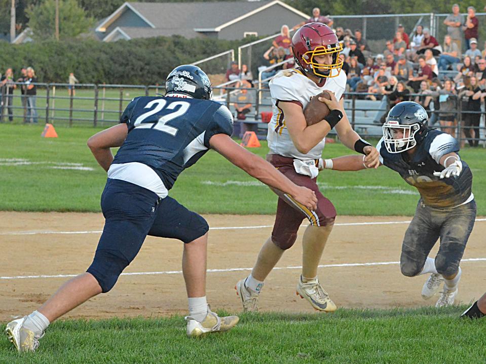 Deubrook Area quarterback Jace Vomacka scores on a conversion run ahead of Great Plains Lutheran defenders Myles York (22) and Thomas Erickson during their high school football game on Friday, Sept. 1, 2023 at Watertown Stadium.