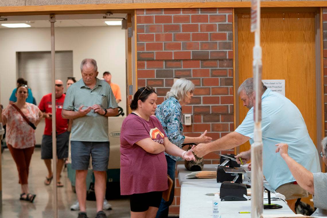 Voters check into Pathway Church at 2001 N Maize Rd