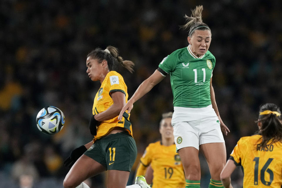 Ireland's Katie McCabe jumps for the ball with Australia's Mary Fowler, left, during the Women's World Cup soccer match between Australia and Ireland at Stadium Australia in Sydney, Australia, Thursday, July 20, 2023. (AP Photo/Mark Baker)
