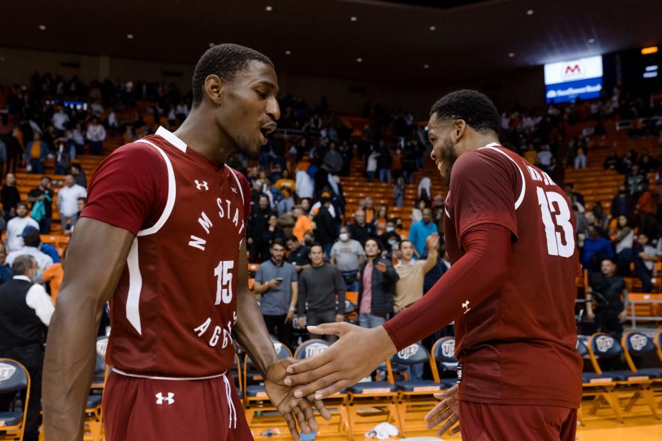 The Aggies basketball celebrate their win against UTEP Friday, Dec. 3, 2021, at the Don Haskins Center in El Paso.