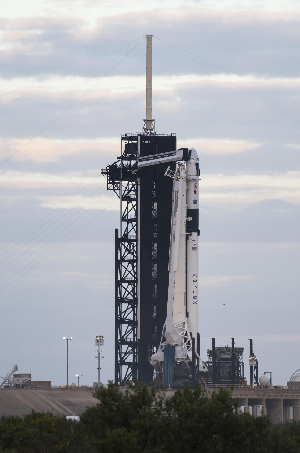 A SpaceX Falcon 9 rocket with the company's Crew Dragon spacecraft onboard is seen on the launch pad at Launch Complex 39A as preparations continue for the Crew-1 mission, Sunday, Nov. 15, 2020, at NASA's Kennedy Space Center in Cape Canaveral, Florida. (Joel Kowsky/NASA via AP)