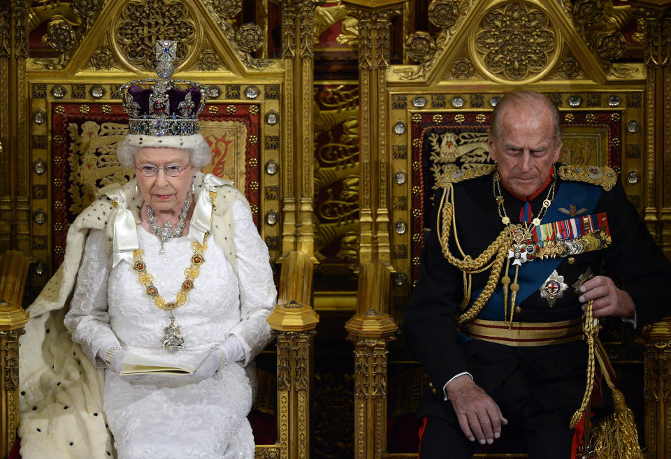 Britain's Queen Elizabeth sits with Prince Philip as she delivers her speech in the House of Lords, during the State Opening of Parliament at the Palace of Westminster in London  June 4, 2014.   REUTERS/Carl Court/Pool   (BRITAIN - Tags: ENTERTAINMENT POLITICS SOCIETY ROYALS)