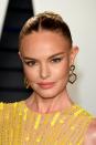 <p>Kate Bosworth had her hair pulled back into a sleek and shiny chignon that had golden strong woven throughout. It mirrored her dress and glittery golden eyeshadow.</p>