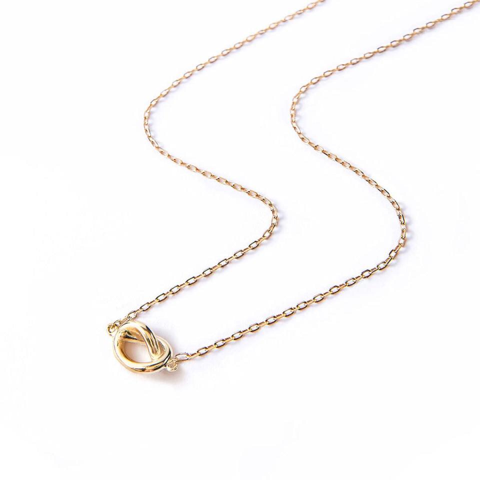 <p><a href="https://amyojewelry.com/products/love-knot-necklace-gold" rel="nofollow noopener" target="_blank" data-ylk="slk:Shop Now;elm:context_link;itc:0;sec:content-canvas" class="link ">Shop Now</a></p><p>Love Knot Necklace</p><p>amyojewelry.com</p><p>$85.00</p><span class="copyright">Amyo</span>