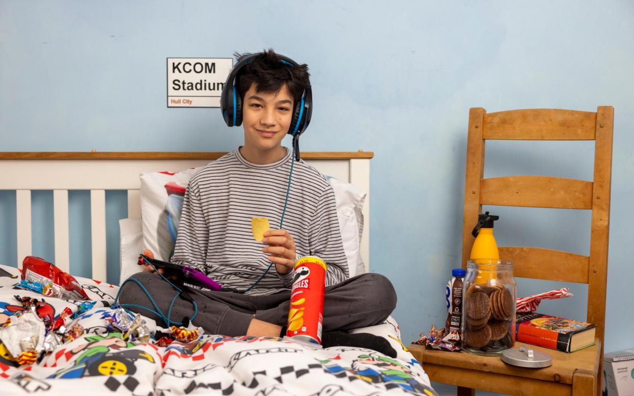 Lucien with his usual snack selection of crisps and chocolate biscuits