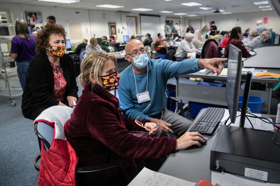 Election workers adjudicate scans of challenged ballots at the Lansing city clerk's office on election night on November 03, 2020 in Lansing, Michigan. (John Moore/Getty Images)