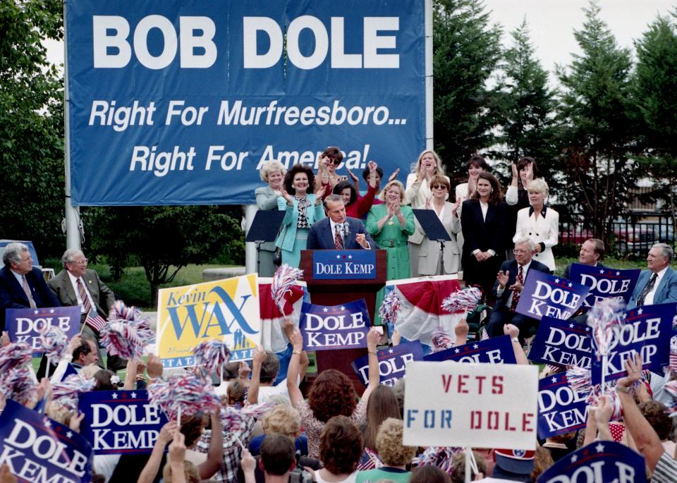 Republican presidential candidate Bob Dole is being cheered on by supporters during a rally on City Plaza in Murfreesboro, Tenn., Sept. 10, 1996. He called for a smaller, less intrusive federal government.