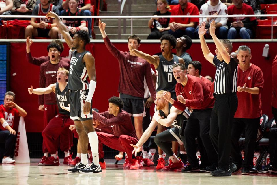 Washington State Cougars bench cheers after guard Kymany Houinsou (31) scores a three point basket during a men’s college basketball game between the University of Utah and Washington State University at the Jon M. Huntsman Center in Salt Lake City on Friday, Dec. 29, 2023. | Megan Nielsen, Deseret News