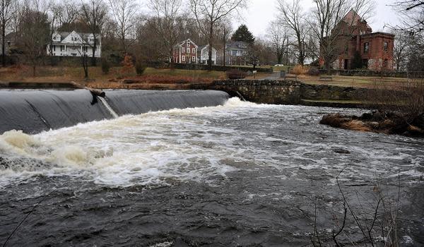 Natick officials have begun the process of removing the Charles River Dam, an aesthetic spillway that has fallen into disrepair.