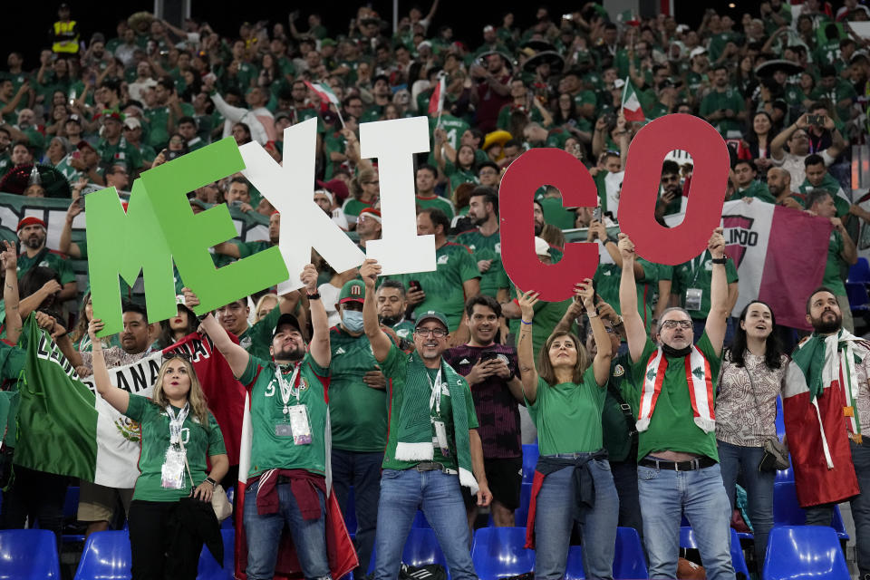 Fans of Mexico cheer during a World Cup group C soccer match against Poland at the Stadium 974 in Doha, Qatar, Tuesday, Nov. 22, 2022. (AP Photo/Martin Meissner)
