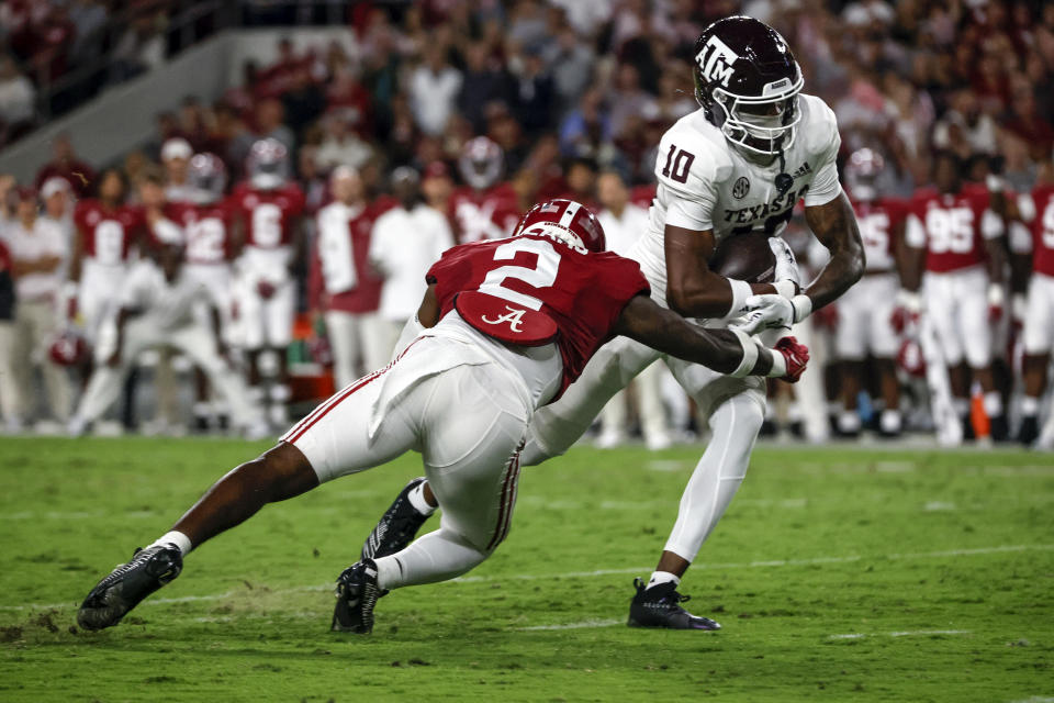 Oct 8, 2022; Tuscaloosa, Alabama; Texas A&M Aggies wide receiver Chris Marshall (10) catches a pass against Alabama Crimson Tide defensive back DeMarcco Hellams (2) at Bryant-Denny Stadium. Butch Dill-USA TODAY Sports