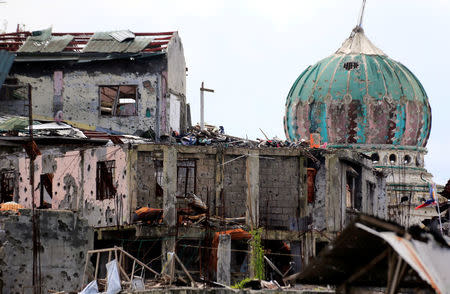 Damaged houses and buildings are seen after government troops cleared the area from pro-Islamic State militant groups inside the war-torn area in Saduc proper, Marawi city, southern Philippines October 22, 2017. REUTERS/Romeo Ranoco