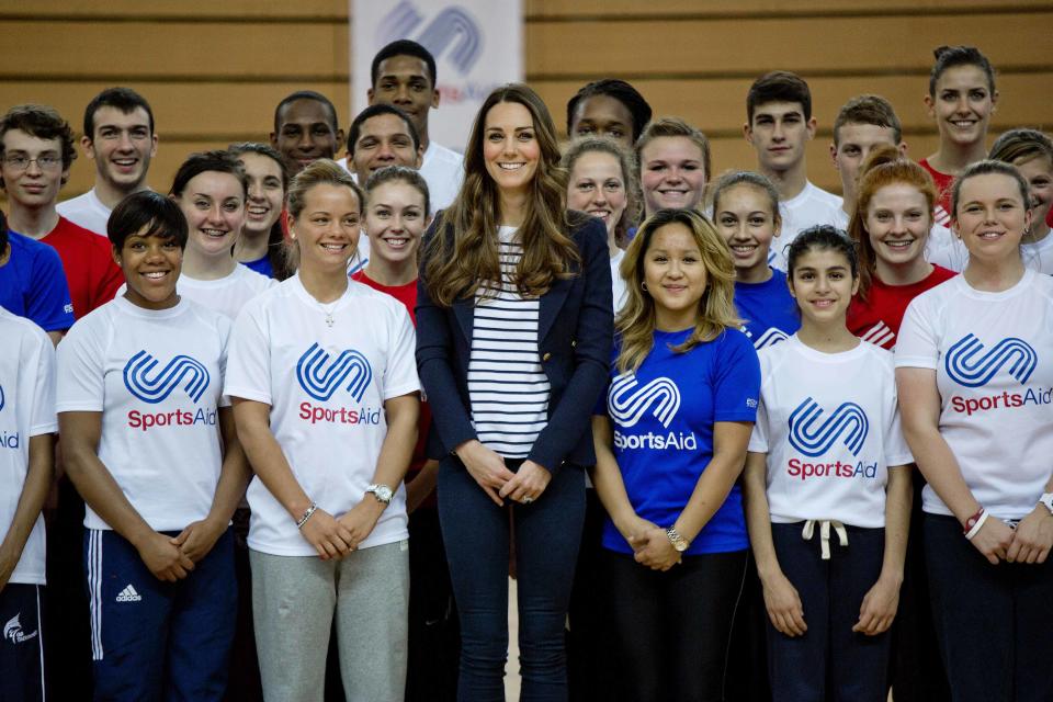 Britain's Catherine, Duchess of Cambridge poses for a group photograph as she attends a SportsAid athlete workshop at the Copper Box in the Olympic Park in London