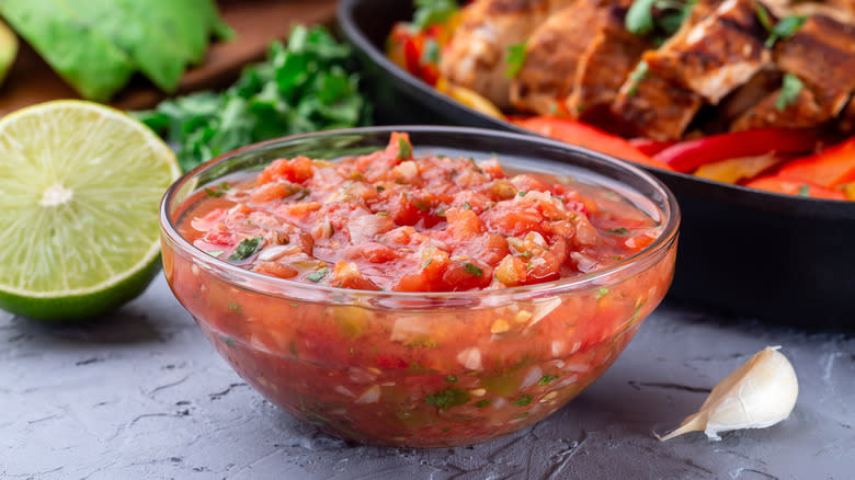 Tomato salsa in glass bowl