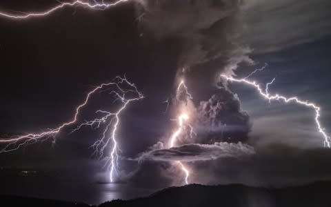 The lightning is caused by volcanic ash sparking static electricity  - Credit: Ezra Acayan/Getty