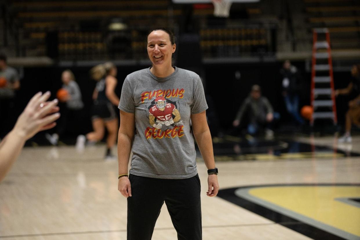 Purdue women's basketball coach Katie Gearlds wears a Kansas City Chiefs jersey pregame.