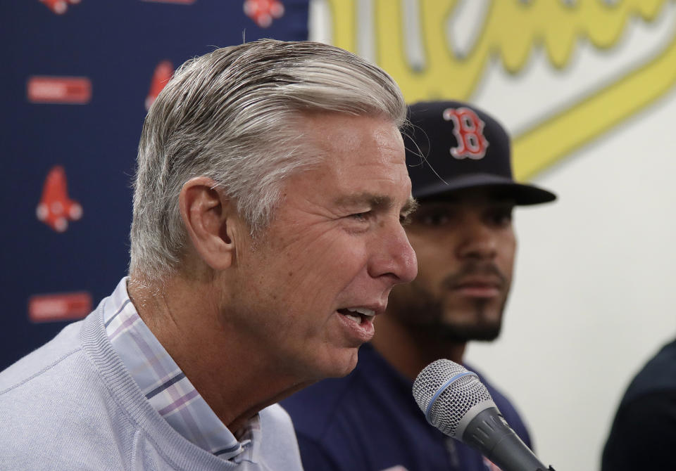 Boston Red Sox team president of baseball operations Dave Dombrowski, left, speaks next to Xander Bogaerts at a news conference before a baseball game against the Oakland Athletics in Oakland, Calif., Monday, April 1, 2019. (AP Photo/Jeff Chiu)