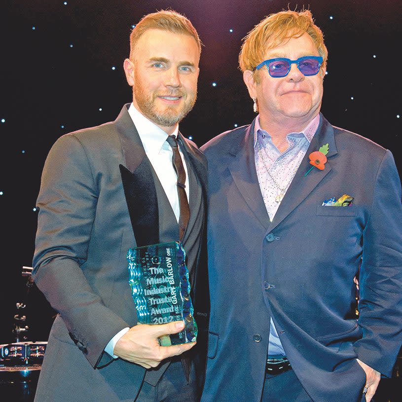 Barlow receiving a Music Industry Trust award from Sir Elton John in 2012.  - David Fisher/Shutterstock 