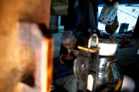 Homeless Makoto Shinbo eats his lunch at his makeshift house at Miyashita park in Tokyo, Japan, February 17, 2017. REUTERS/Kim Kyung-Hoon