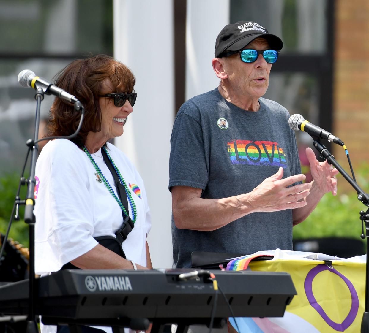 Mayor Thomas Bernabei with his wife, Bebe Bernabei, tells the crowd that everyone is welcome in Canton at the kickoff of Stark Pride Festival in June 2023.