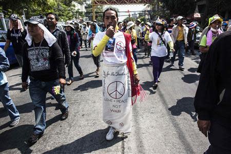 An anti-government protester blowing a whistle takes part in a rally in Bangkok January 24, 2014. REUTERS/Nir Elias