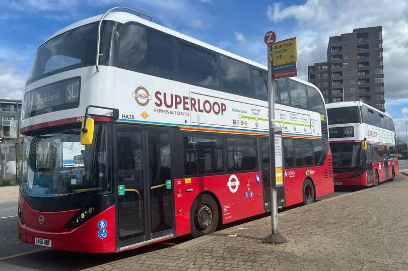 Two SL7 Superloop buses at a bus stop