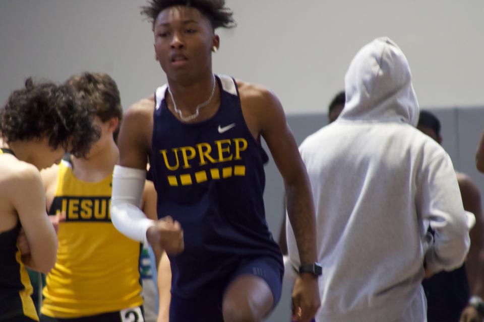 University Prep sprinter OJ Singletary warming up during a Rochester Winter Track League meet during the 2022-23 season.