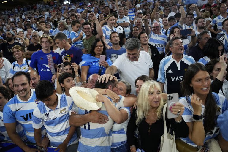 Argentina's Mateo Carreras hugs relatives and friends at the end of the Rugby World Cup quarterfinal match between Wales and Argentina at the Stade de Marseille in Marseille, France, Saturday, Oct. 14, 2023. (AP Photo/Pavel Golovkin)