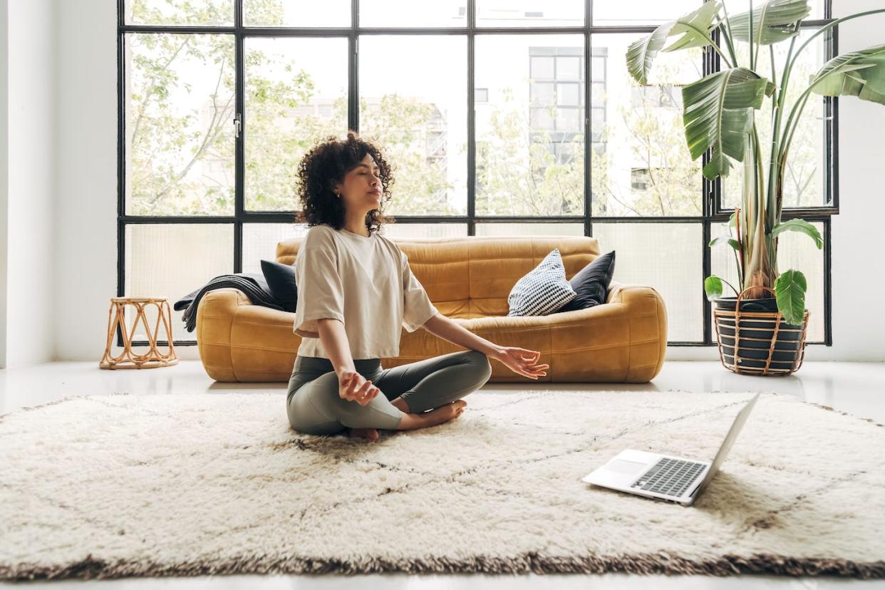 People of any age or walk of life can access and benefit from meditation. <a href="https://www.gettyimages.com/detail/photo/young-multiracial-latina-woman-meditating-at-home-royalty-free-image/1394449576?phrase=mindfulness%20meditation&adppopup=true" rel="nofollow noopener" target="_blank" data-ylk="slk:Daniel de la Hoz/iStock via Getty Images Plus;elm:context_link;itc:0;sec:content-canvas" class="link ">Daniel de la Hoz/iStock via Getty Images Plus</a>