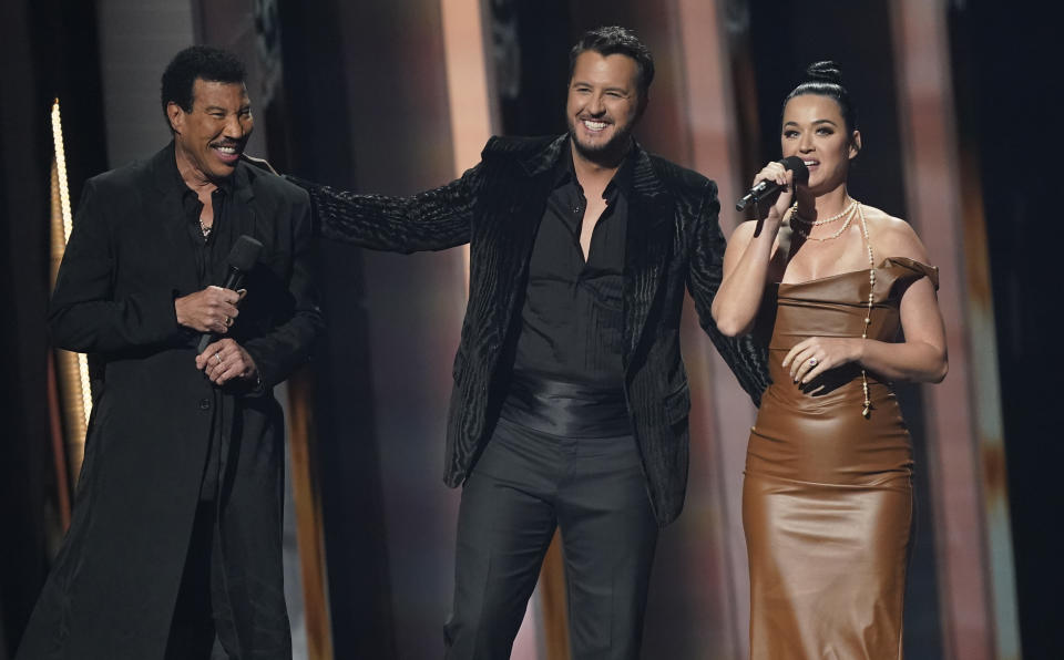 Lionel Richie, from left, Luke Bryan and Katy Perry appear on stage at the 55th annual CMA Awards on Wednesday, Nov. 10, 2021, at the Bridgestone Arena in Nashville, Tenn. (AP Photo/Mark Humphrey)