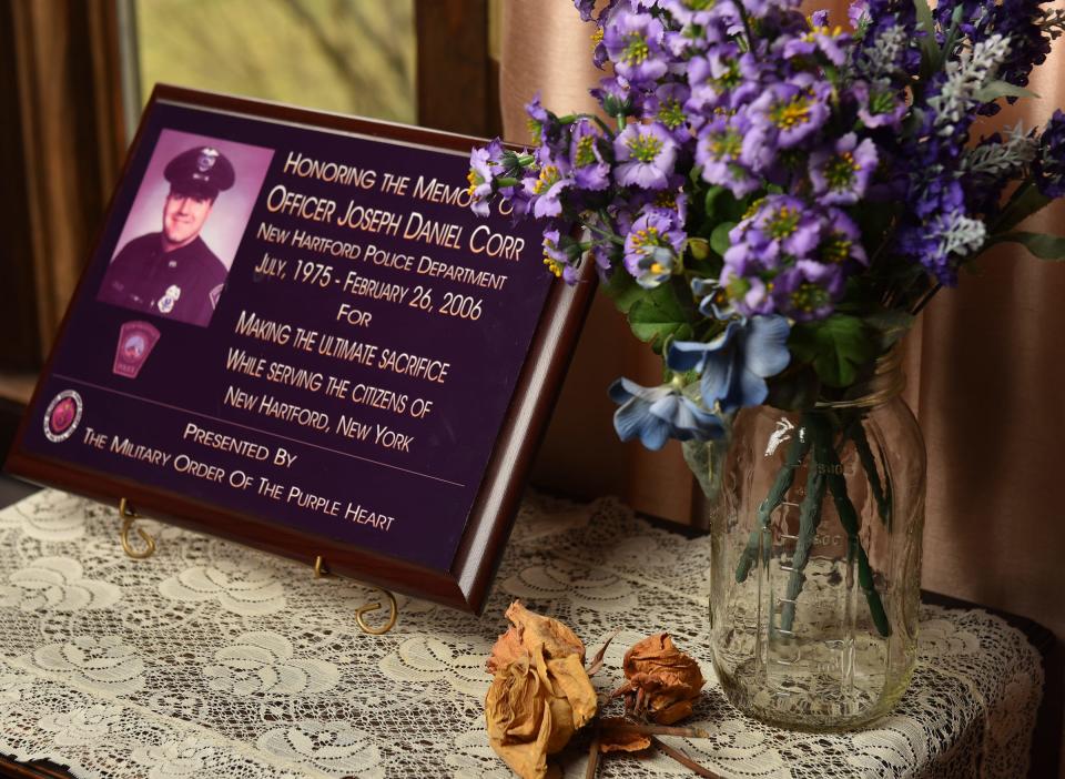 A memorial plaque is displayed in the home of David and Kathy Corr Feb. 5, 2016, in New Hartford, N.Y. Their son, New Hartford Police Officer Joseph Corr, was shot and killed in the line of duty Feb. 27, 2006.