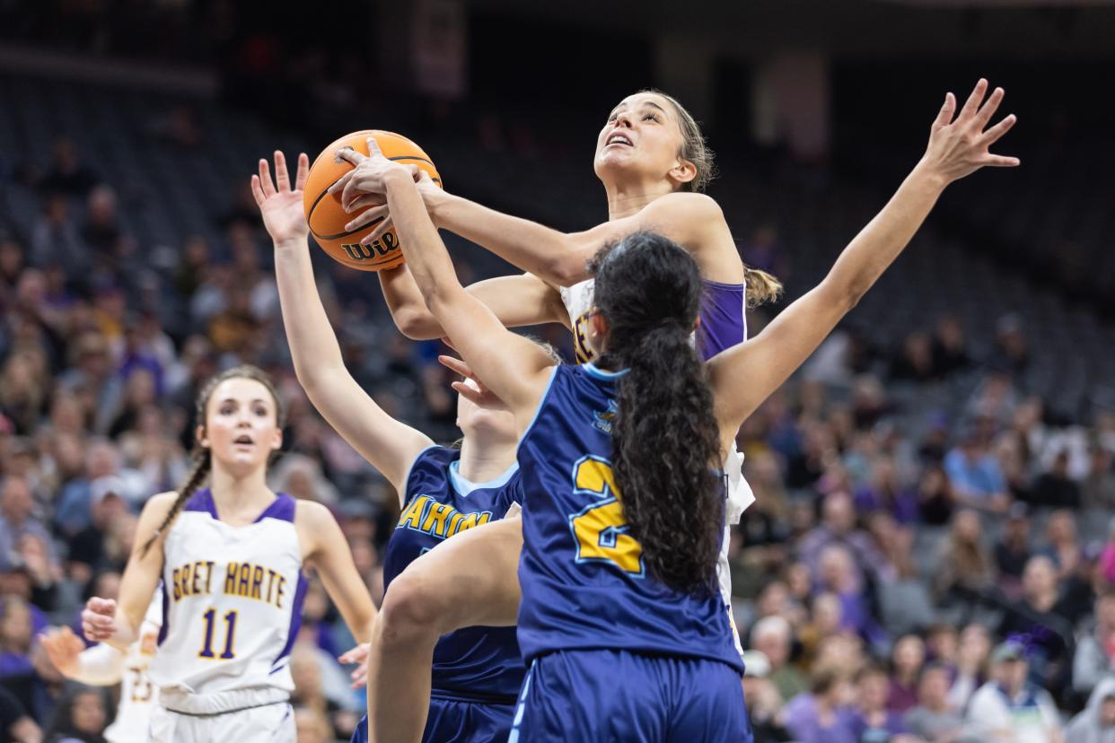 Bret Harte Bullfrogs Ariah Fox (5) goes up strong to the basket with Marina Vikings guard Maria Tejeda (2) putting pressure on her in the second half in the CIF Division V girls basketball State Championship on Saturday, March 11, 2023, at Golden 1 Center in Sacramento. Fox had a double-double with 22 points and 15 rebounds. The Bullfrogs defeated the Vikings 62-39. (SARA NEVIS/FOR THE RECORD)