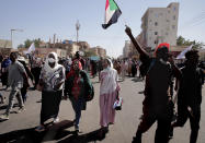 People chant slogans during a demonstration against the killing of dozens by Sudanese security forces since a military coup three months ago, in Khartoum, Sudan, Monday, Jan. 24, 2022. (AP Photo/Marwan Ali)