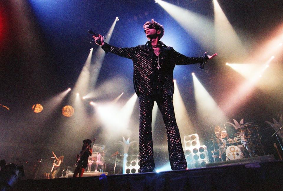 Prince performs Dec. 17, 1997, at the Bradley Center in Milwaukee, during the phase of his career when he called himself “The Artist Formerly Known As Prince.” (Photo by William Lizdas/Milwaukee Journal Sentinel – USA Today Network)