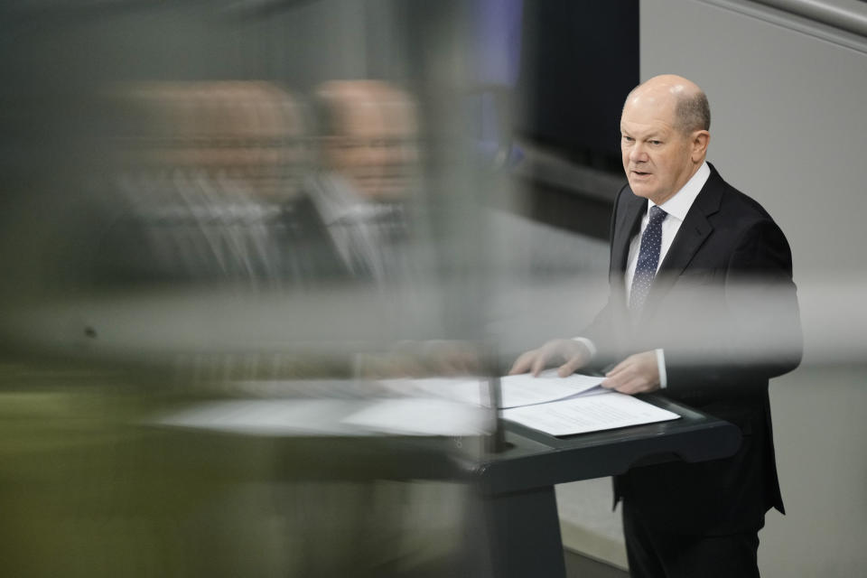 German Chancellor Olaf Scholz delivers a speech about Germany's budget crisis at the parliament Bundestag in Berlin, Germany, Tuesday, Nov. 28, 2023. With its economy already struggling, Germany now is wrestling to find a way out of a budget crisis after a court struck down billions in funding for clean energy projects and help for people facing high energy bills because of Russia's war in Ukraine. (AP Photo/Markus Schreiber)