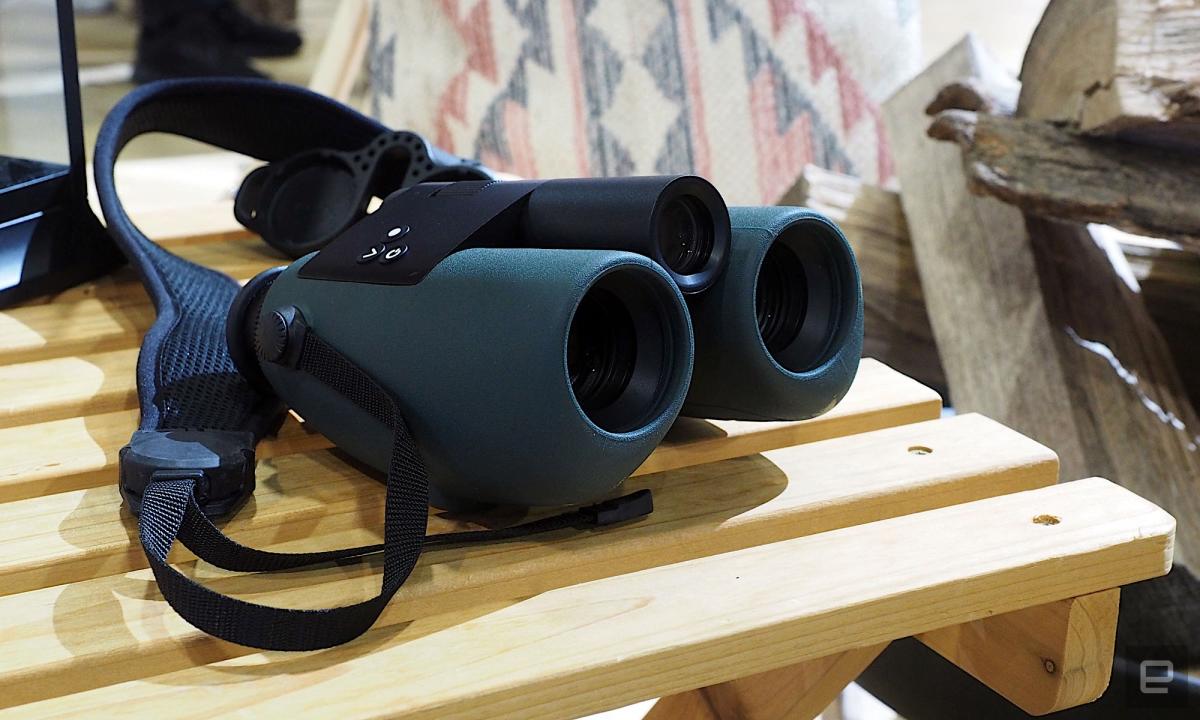 Image of Swarovski's AX Visio smart bird-identifying binoculars on a wooden picnic table.