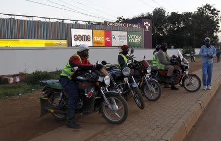 Motorcycle taxis wait for clients outside the evacuated Garden City shopping Mall in Kenya's capital Nairobi, September 8, 2015. REUTERS/Thomas Mukoya