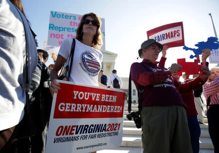 Demonstrators rally during oral arguments in Gill v. Whitford, a case about partisan gerrymandering in electoral districts, at the Supreme Court in Washington, U.S., October 3, 2017. REUTERS/Joshua Roberts