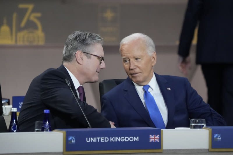President Joe Biden and U.K. Prime Minister Kier Starmer converse during a working session at the NATO Summit Washington, D.C. on Thursday. Photo by Chris Kleponis/UPI