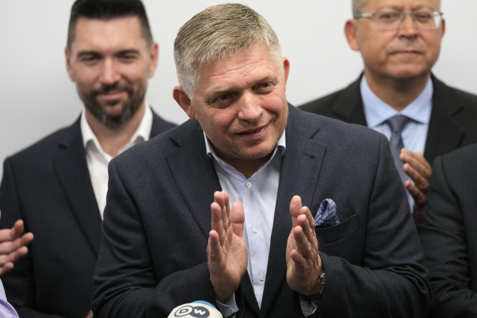 Chairman of Smer-Social Democracy party Robert Fico, center, adresses the results of an early parliamentary election during a press conference in Bratislava, Slovakia, Sunday, Oct. 1, 2023. A populist former prime minister and his leftist party have won parliamentary elections in Slovakia, staging a political comeback after campaigning on a pro-Russian and anti-American message. (AP Photo/Darko Bandic)
