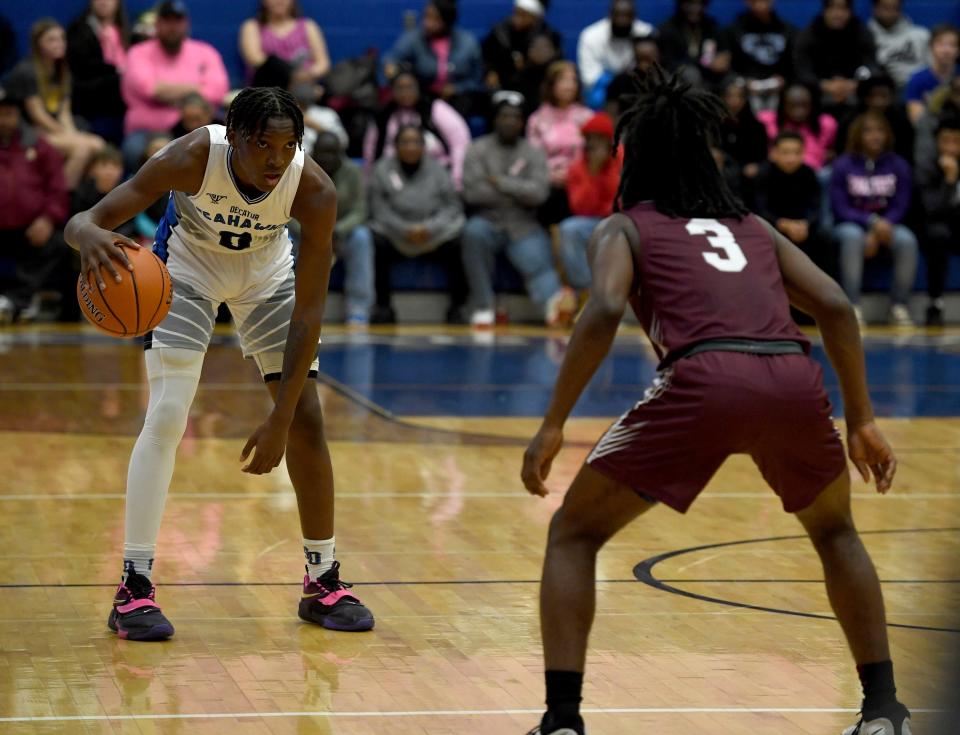 Decatur's Davin Chandler (0) dribbles in the game against Snow Hill Thursday, Jan. 19, 2023, in Berlin, Maryland. The Seahawks defeated the Eagles 77-74.