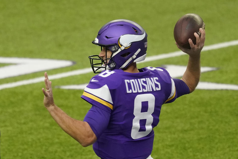 Minnesota Vikings quarterback Kirk Cousins warms up before an NFL football game against the Atlanta Falcons, Sunday, Oct. 18, 2020, in Minneapolis. (AP Photo/Jim Mone)