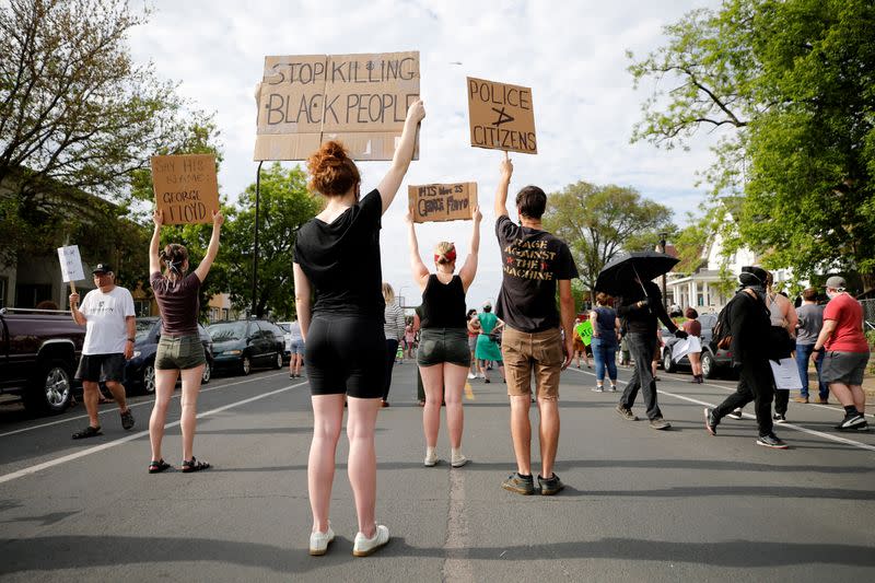 Protesters gather at the scene where Floyd was pinned down by a police officer in Minneapolis