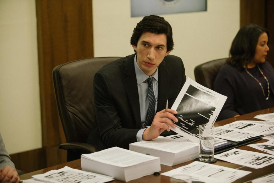 Daniel Jones (Adam Driver) looks through pages of his investigation redacted by the CIA in "The Report."