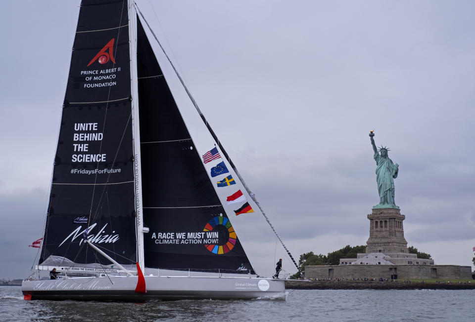 Greta Thunberg, a 16-year-old Swedish climate activist, sails into New York harbor aboard the Malizia II, Wednesday, Aug. 28, 2019. The zero-emissions yacht left Plymouth, England on Aug. 14. She is scheduled to address the United Nations Climate Action Summit on Sept. 23. (AP Photo/Craig Ruttle)