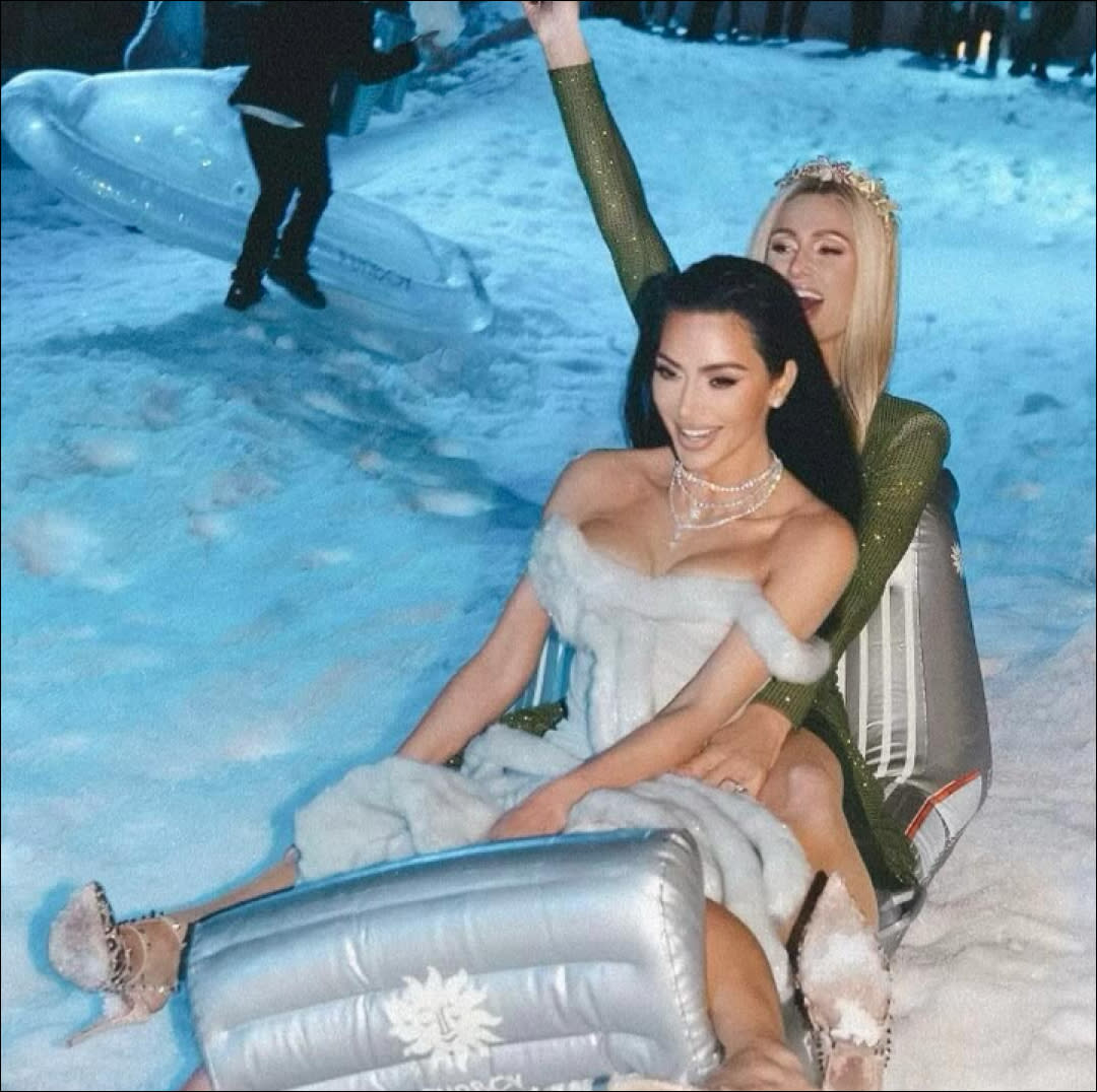  Kim Kardashian and BFF Paris Hilton shimmer in new Christas Eve party photos. 