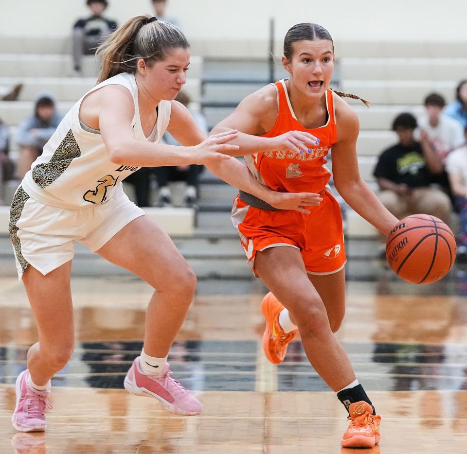 Hamilton Heights Huskies Ella Hickok (2) rushes up the court against Lapel Bulldogs Annalee Stow (33) on Tuesday, Dec. 19, 2023, during the game at Lapel High School in Lapel. The Hamilton Heights Huskies defeated the Lapel Bulldogs, 53-41.