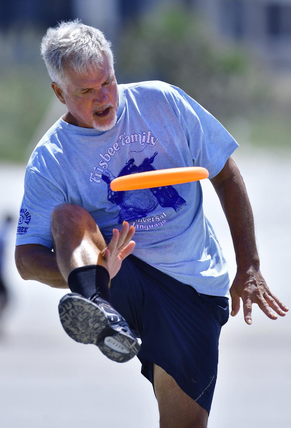 Paul Kenny, inducted into the Freestyle Disc Hall of Fame last month, demonstrates his skills on the sand at Jacksonville Beach, where he lives.