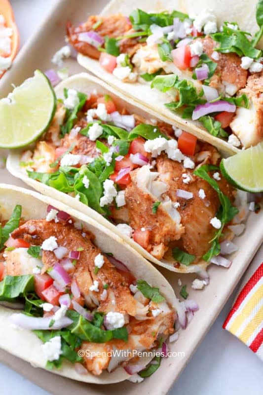 <p>Spend With Pennies</p><p>Fill some corn tortillas with flaky white fish that has been rubbed with a flavorful spice mixture and add your favorite toppings. Get this <a href="https://www.spendwithpennies.com/fish-tacos-recipe-onion-slaw/" rel="nofollow noopener" target="_blank" data-ylk="slk:Easy Fish Tacos;elm:context_link;itc:0;sec:content-canvas" class="link rapid-noclick-resp">Easy Fish Tacos</a> recipe!</p>