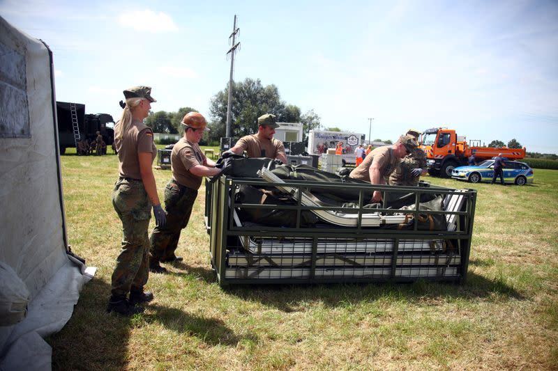 Soldiers of the German armed forces Bundeswehr build tents to be used as a testing site for the coronavirus disease (COVID-19) in Landau an der Isar